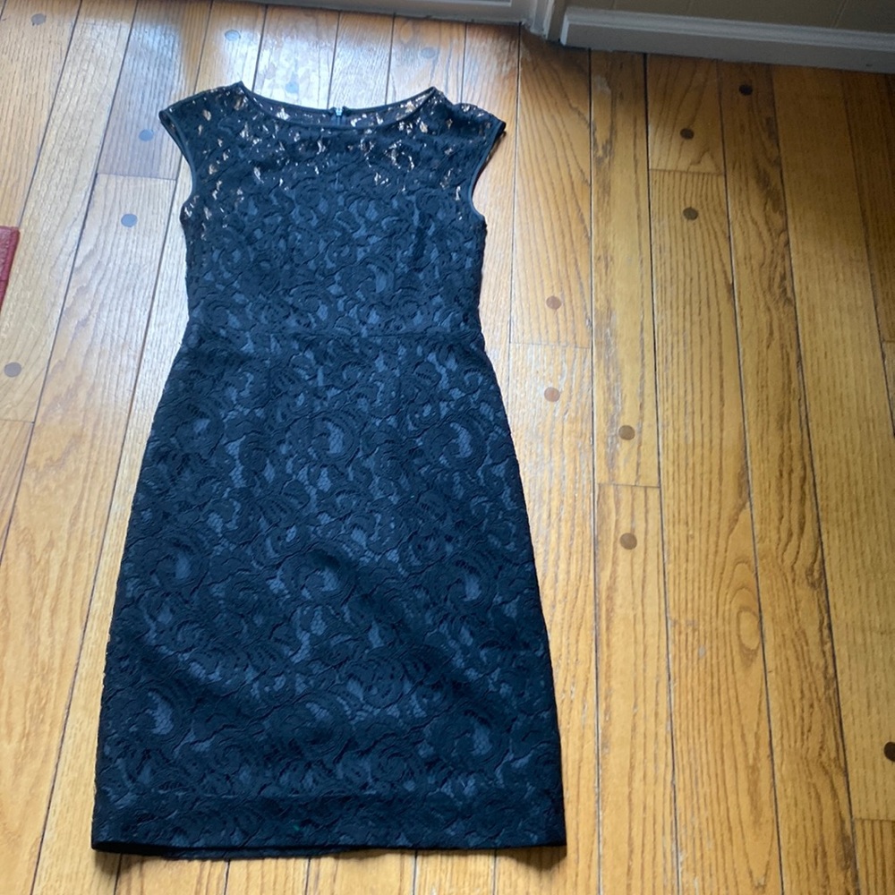 Beautiful black lace dress. Worn once at a wedding. Size 2. Back zipper. Lined.